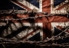 UK flag behind barbed wire